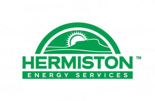 Hermiston Energy Service logo. Sunrise coming up from a hill