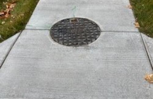 Manhole in a sidewalk 
