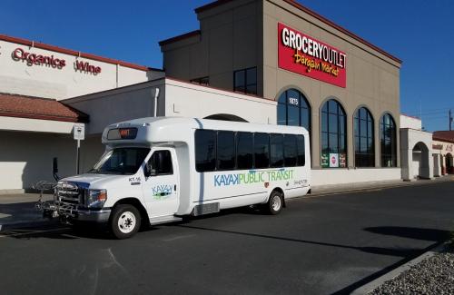 Kayak Bus stopped in front of a store