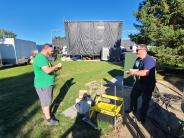 IT staff works at an outdoor venue