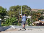 IT staff works on a rooftop install