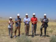 Hermiston leaders stand with shovels at the groundbreaking of the South Hermiston Industrial Park.