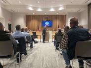 Carlisle Harrison speaks to the audience at Hermiston City Hall