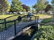 Photo of a resident walking across Belt Park bridge
