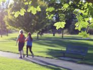 Two people walking at Riverfront Park.