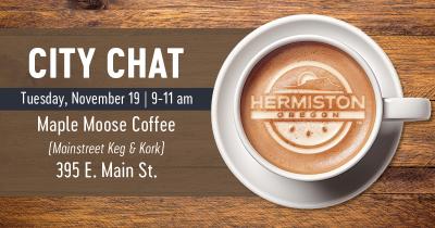 Cup of coffee with Hermiston logo in the foam