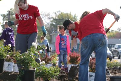 People planting flowers