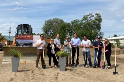 People break ground with shovels at Moorehouse Apartments