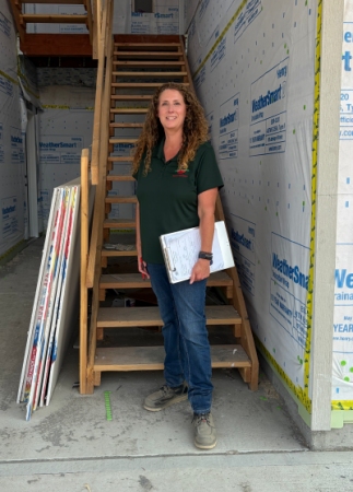 Heaven Doherty stands at building inspection site