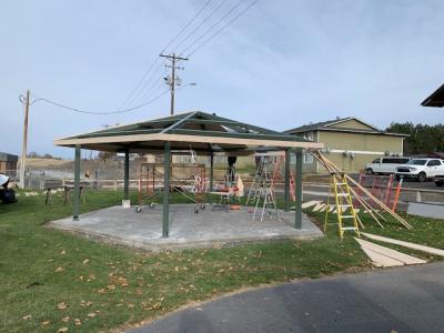 Volunteers construct a pavilion at Harrison Park
