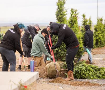 Volunteers plant trees at EOTEC.