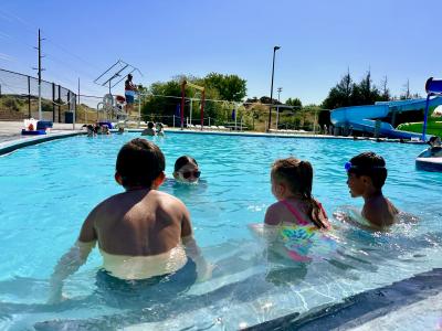 Elementary students participate in swim lessons on a sunny day at Hermiston Family Aquatic Center