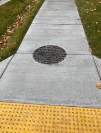 Manhole in a sidewalk 