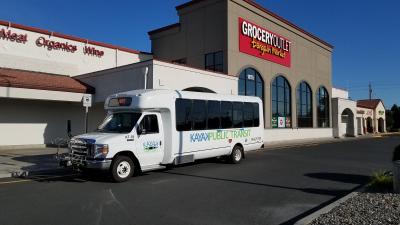 Kayak Bus stopped in front of a store