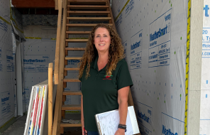 Heaven Doherty stands at building inspection site
